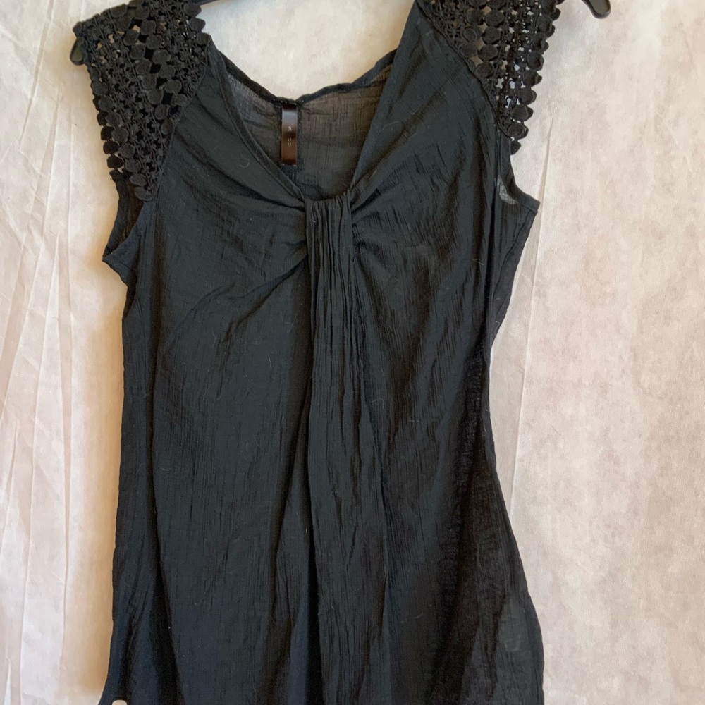 Elegant Black Sleeveless Top with shoulder detailing